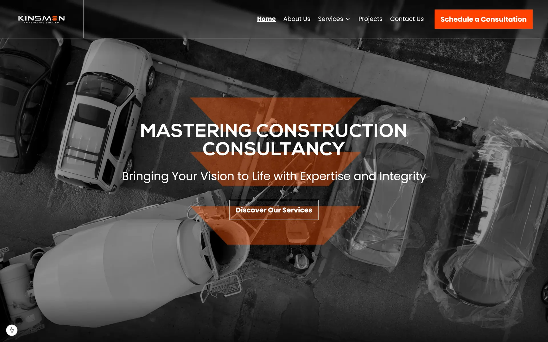 Homepage hero with greyscale aerial site video and orange chevron branding